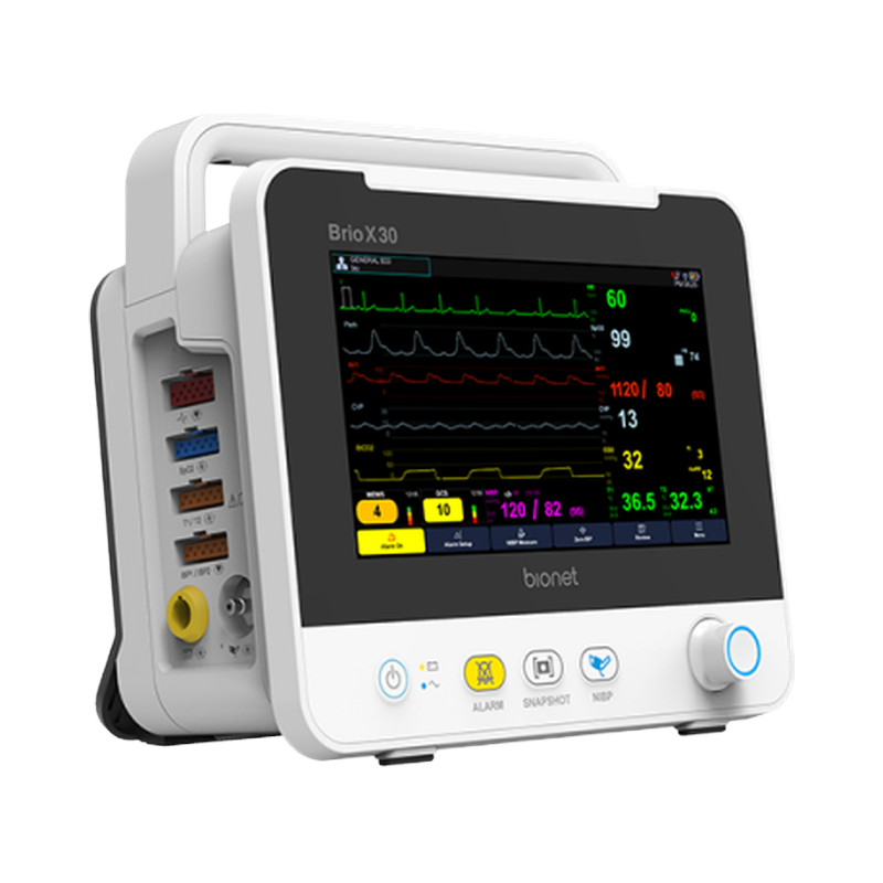 Brio X30 patient monitor standalone unit showing EWS and GCS scoring buttons, left three-quarter view with visible I/O ports