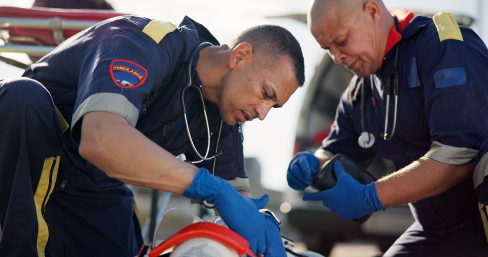 Emergency medical professionals providing critical patient care to support patient safety and effective emergency response.